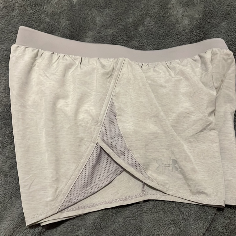 Under armor gray shorts. Heat gear for women. Helps keep you cool.